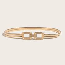Eleve seu visual com este elegante cinto elástico dourado com fivela dupla