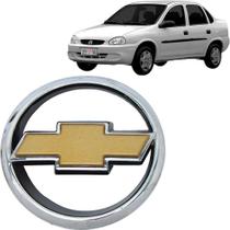 Emblema Grade Corsa Hatch Sedan 99/01 Com Gravata Dourada - MARÇON EMBLEMAS