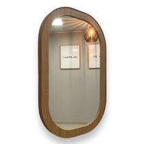 Espelho retoval 70cm x 50cm, moldura freijó (amadeirado ), acabamento lateral em couro.