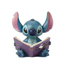 Estatueta Enesco Disney Traditions Jim Shore Stitch com livro