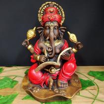 Ganesha com livro envelhecida com vermelho 25cm Ganesha com livro envelhecida com vermelho 25cm