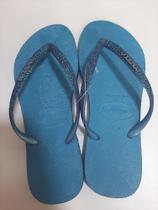 Havainas com brilho azul turquesa