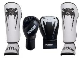 Kit Caneleira Giant Branco e Luvas Boxe Muay Thai Logo Pro Preto Venum Kit Caneleira Giant Branco e Luvas Boxe Muay Thai Logo Pro Preto Venum