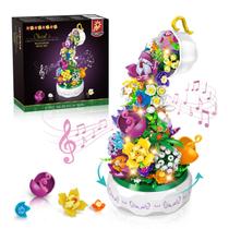Kit de blocos de construção Caixa de música HOGOKIDS Flowers com luz 571 unidades