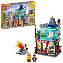 LEGO 31105 Creator 3-in-1 Townhouse Toy Store - Cake Shop - Florist Building Set, com Flores e Working Rocket Ride, para crianças de 8 anos