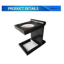 Lupa Conta Fios 8x dobrável em plástico com escala em milímetro (resolução 1mm) e polegada