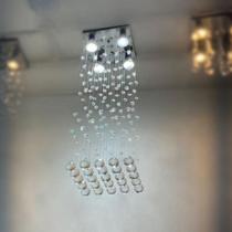 Lustre de Cristal Legítimo K9 com 60 cm de Altura Para Sala de Jantar Base Toda Em Aço Inox Espelhado - Casa Cristalle