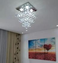 Lustre de cristal para sala quarto com 40 cm de altura base de inox espelhado 30x30 cm Lustre de cristal para sala quarto com 40 cm de altura base de inox espelhado 30x30 cm