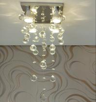Lustre em cristais legítimos K9, para Sala de Jantar e Hall Social, com 50 cm de Altura, Base de Inox Polido de 20x20cm