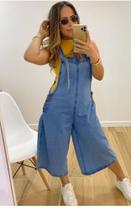 Macacão pantacurt jeans claro,com m amarração no ombro