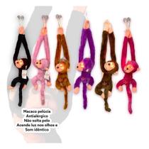 Macaco Pelúcia Com Som E Luz De Pendurar Antialérgico Grita Brinquedo Cores