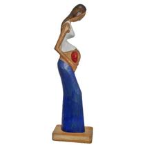 Mãe gravida com bebê segurando madeira Sertânia arte 96 Mãe gravida com bebê segurando madeira Sertânia arte 96