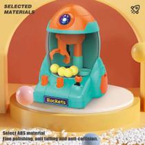 Mini Máquina de Pegar Bolinhas Formato de Foguete com Garra e Bolas