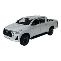 Miniatura Toyota Hilux Branco Maisto 1:27