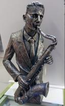 músico resina saxofone