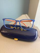 Óculos infantil Tigor T. Tigre modelo 133 na cor azul claro e laranja Óculos infantil Tigor T. Tigre modelo 133 na cor azul claro e laranja