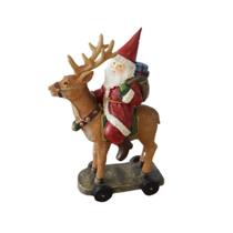 Papai noel em resina montado na rena novo