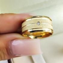 Par de Aliancas em Ouro 18K colecao Eternize 7 mm, e 1 diamante Par de Aliancas em Ouro 18K colecao Eternize 7 mm, e 1 diamante