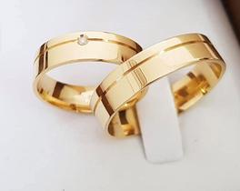 Par de alianças em Ouro 18K com 5mm de largura e 1 pedra. Solitario semi joia de presente. ENVIE MSG NO CHAT PARA A NUMERACAO E GRAVACAO Par de alianças em Ouro 18K com 5mm de largura e 1 pedra. Solitario semi joia de presente. ENVIE MSG NO CHAT PARA A NUMERACAO E GRAVACAO