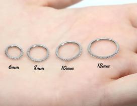 Piercing Argola em Titâneo cravejada com pedras zircônia Piercing Argola em Titâneo cravejada com pedras zircônia