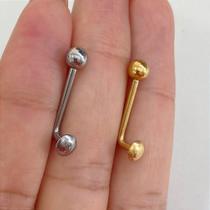 Piercing genital em titânio com disco dourado