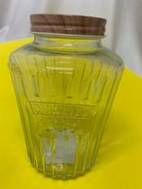 Pote de vidro com tampa de alumínio.