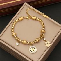 Pulseira aço inoxidável banhada a ouro com zirconias e madrepérola trevo