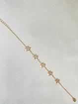 pulseira com detalhe em estrela cravejada em zircônias banhada a ouro 18k