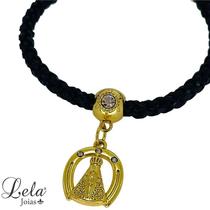 Pulseira couro trançado preto com pingente nossa senhora em bijuteria