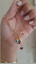 Pulseira folheada com coração e detalhe de olho grego. Pulseira folheada com coração e detalhe de olho grego.