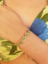 Pulseira gravata em cristais verdes banhas em ouro 18k