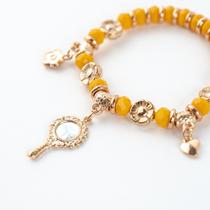 Pulseira Oxum Amarelo Gema Abebe e Flor Cristal Silicone
