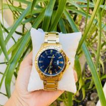 Relogio seculus masculino dourado fundo azul - SECLUS