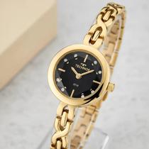 Relógio Technos Feminino Mini Dourado Aço Inoxidável Bisel Preto Resistência Água Relógio Technos Feminino Mini Dourado Aço Inoxidável Bisel Preto Resistência Água