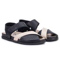 Sandália Astrid com tiras autocolantes Traseiro e Frente Trançada Couro Preto e Off White Sandália Astrid com tiras autocolantes Traseiro e Frente Trançada Couro Preto e Off White