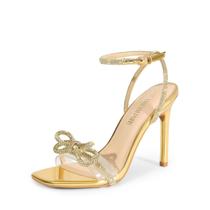 Sandália DREAM PAIRS Brielle Dourada com Strass e Salto Transparente 10 cm Sandália DREAM PAIRS Brielle Dourada com Strass e Salto Transparente 10 cm
