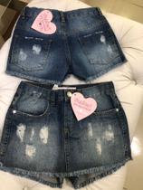 Short saia jeans tamanhos 08 e 10 anos