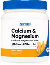 Suplemento mineral Nutricost Cálcio Magnésio em pó Pêssego Manga Suplemento mineral Nutricost Cálcio Magnésio em pó Pêssego Manga