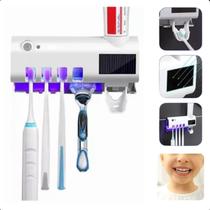 Suporte com Luz UV e Dispenser de Pasta Automático Suporte com Luz UV e Dispenser de Pasta Automático