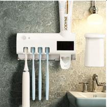 Suporte para Escovas de Dentes com Esterilizador UV e Dispensador Automático Design Clean Suporte para Escovas de Dentes com Esterilizador UV e Dispensador Automático Design Clean