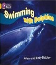 Swimming with dolphins - COLLINS Swimming with dolphins - COLLINS