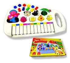 Brinquedo infantil pianinho musical fazendinha musicas sons de animais luz  e alca