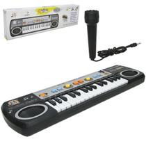 Teclado / piano musical infantil com microfone preto a pilha