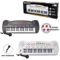 Teclado / piano musical infantil com microfone preto / branco hs-999 a pilha - DM BRASIL