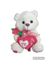 Urso de pelúcia de 25cm com rosa