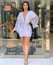 Vestido em paitês recorte profundo