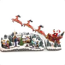 Vila Natal Gigante Luxo 90 cm Iluminado Musical Nevada Vilarejo Natalino Bivolt com Papai Noel Trenó e Renas