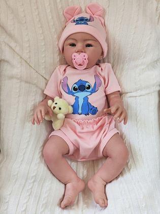 Imagem de Bebê Reborn Menina Realista Ana Dolls 50cm, Corpo Silicone Pode Tomar Banho, Carequinha Caneta Stitch Enxoval Completo de 13 Itens