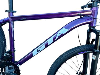Imagem de Bicicleta Aro 29 Gta Start Alumínio 27v K7 Freio a Disco Mecânico Garfo com Suspensão. Roxo