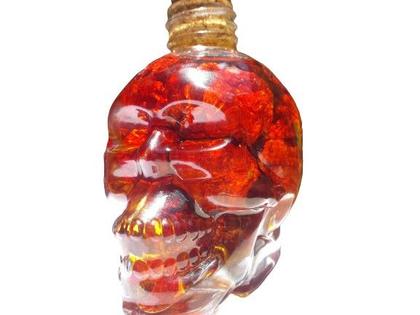 Imagem de Carolina reaper dessecada curtida no azeite com alecrim